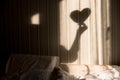 Woman making heart shadow on the wall. World mental health day, hope and love. Valentines 14 February Royalty Free Stock Photo