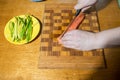 Woman making at home Japanese sushi rolls. Making at home Japanese-style hand-rolled sushi Royalty Free Stock Photo