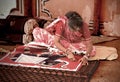 Woman making Indian carpet