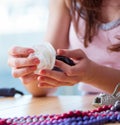 Woman making jewelry at home Royalty Free Stock Photo