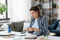 woman making or knotting macrame on table at home Royalty Free Stock Photo