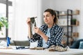 woman making or knotting macrame on table at home Royalty Free Stock Photo