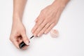 Woman making manicure by herself on grey background Royalty Free Stock Photo