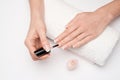 Woman making manicure by herself on grey background Royalty Free Stock Photo