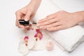 Woman making manicure by herself on grey background Royalty Free Stock Photo