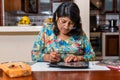 Woman making an embossed frame