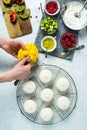 Woman Making Mini Tropical Fruit Pavlovas