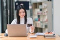 A woman making an online purchase on a computer using a mockup credit card. Royalty Free Stock Photo