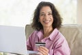 Woman making online purchase at home