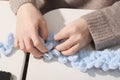 woman making pattern with yarn and fingers. hand knitting as hobby for relaxation and inner peace. unrecignizable woman Royalty Free Stock Photo