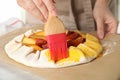 Woman making peach pie, closeup