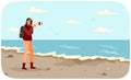 Woman is making photo of amazing landscape. Girl with camera is looking into lens on seascape Royalty Free Stock Photo