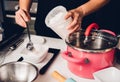 Woman during making pour measure dough Royalty Free Stock Photo