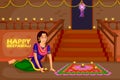 Woman making rangoli for Diwali celebration festival of India