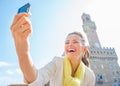 Woman making selfie in front of palazzo vecchio Royalty Free Stock Photo