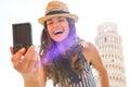 Woman making selfie in front of tower of pisa Royalty Free Stock Photo