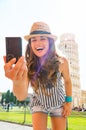 Woman making selfie in front of tower of pisa Royalty Free Stock Photo