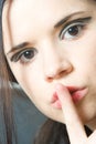 Woman making silence sign