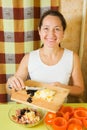 Woman making stuff for tomato