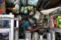 Woman making tea at a street stall in Kerala, India