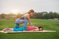 Woman making thai massage to mature woman.