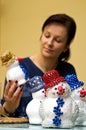 Woman making toy snowman Royalty Free Stock Photo