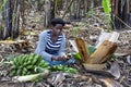 Woman making local dish of Matooke, Uganda, Africa