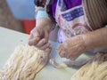 Woman making traditional pork sausage skins using pig intestines. Rustic, rural Italy. Genuine farm production. Royalty Free Stock Photo