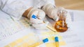 Woman making urine test with ph material in laboratory