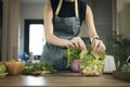 Woman making vegetable salad on kitchen at home. Healthy lifestyle concept. Royalty Free Stock Photo