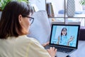 Woman making video call with doctor, online meet at home Royalty Free Stock Photo