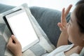 Woman making a video call on tablet.