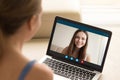 Woman making video call to female friend on laptop. Royalty Free Stock Photo