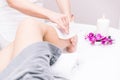Woman making waxing on her legs Royalty Free Stock Photo