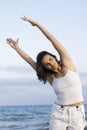 Woman making yoga exercise on the beach Royalty Free Stock Photo