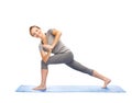 Woman making yoga low angle lunge pose on mat Royalty Free Stock Photo