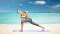 Woman making yoga low angle lunge pose on mat Royalty Free Stock Photo