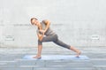 Woman making yoga low angle lunge pose on mat Royalty Free Stock Photo