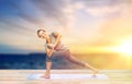 Woman making yoga low angle lunge pose on mat Royalty Free Stock Photo