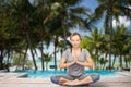 Woman making yoga meditation in lotus pose Royalty Free Stock Photo