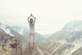 Woman making yoga over a mountain Royalty Free Stock Photo