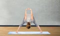 Woman making yoga in wide-legged forward bend pose Royalty Free Stock Photo