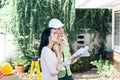 Woman And male engineer, are looking at point and discuss about renovating the old house to be new home Royalty Free Stock Photo