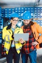 Woman and man as workers in logistics center using computer Royalty Free Stock Photo