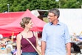 Woman and man buying stuff on flea market