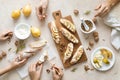 Woman, man and child are cooking sweet open sandwiches with ricotta cheese, fresh pears, walnuts and honey on kitchen Royalty Free Stock Photo