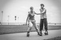 Woman and man couple rollerskates outdoor