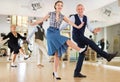 Woman and man dancing swing in studio