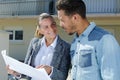 woman and man discuss construction plan Royalty Free Stock Photo
