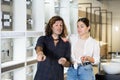 Woman and man discussing shopping list and pointing to something in store Royalty Free Stock Photo